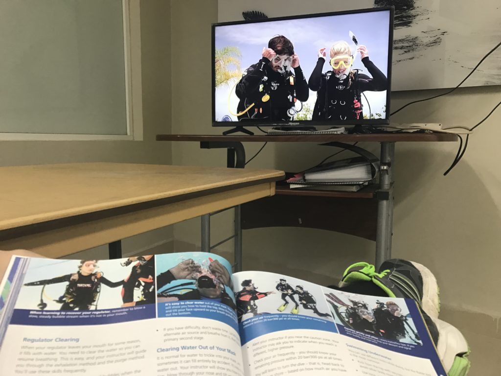 Photo of me studying for my diver's license in the beginning of my travels - Cancún, México Mar 2017