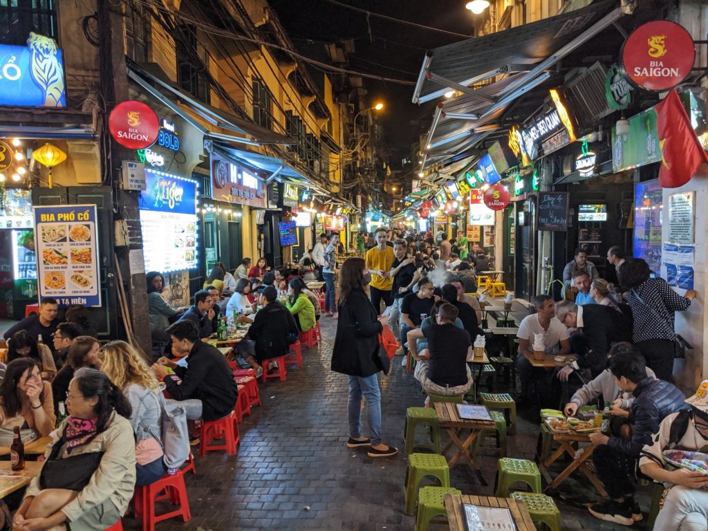 Busy street food alley in Hanoi